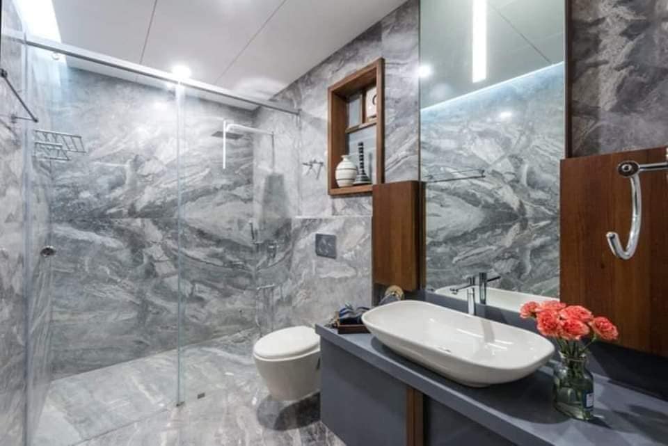 Modern Bathroom with Marble Walls and Glass Shower