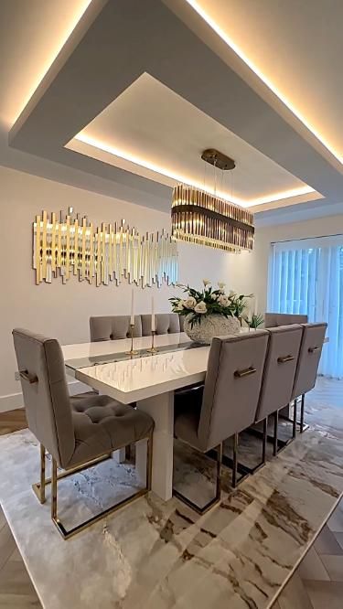 Modern Dining Room with Gold Accents and Statement Lighting