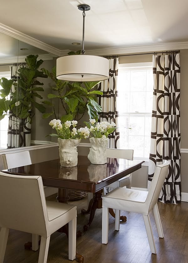 Contemporary Dining Room with Mirror Accents and Wood Table