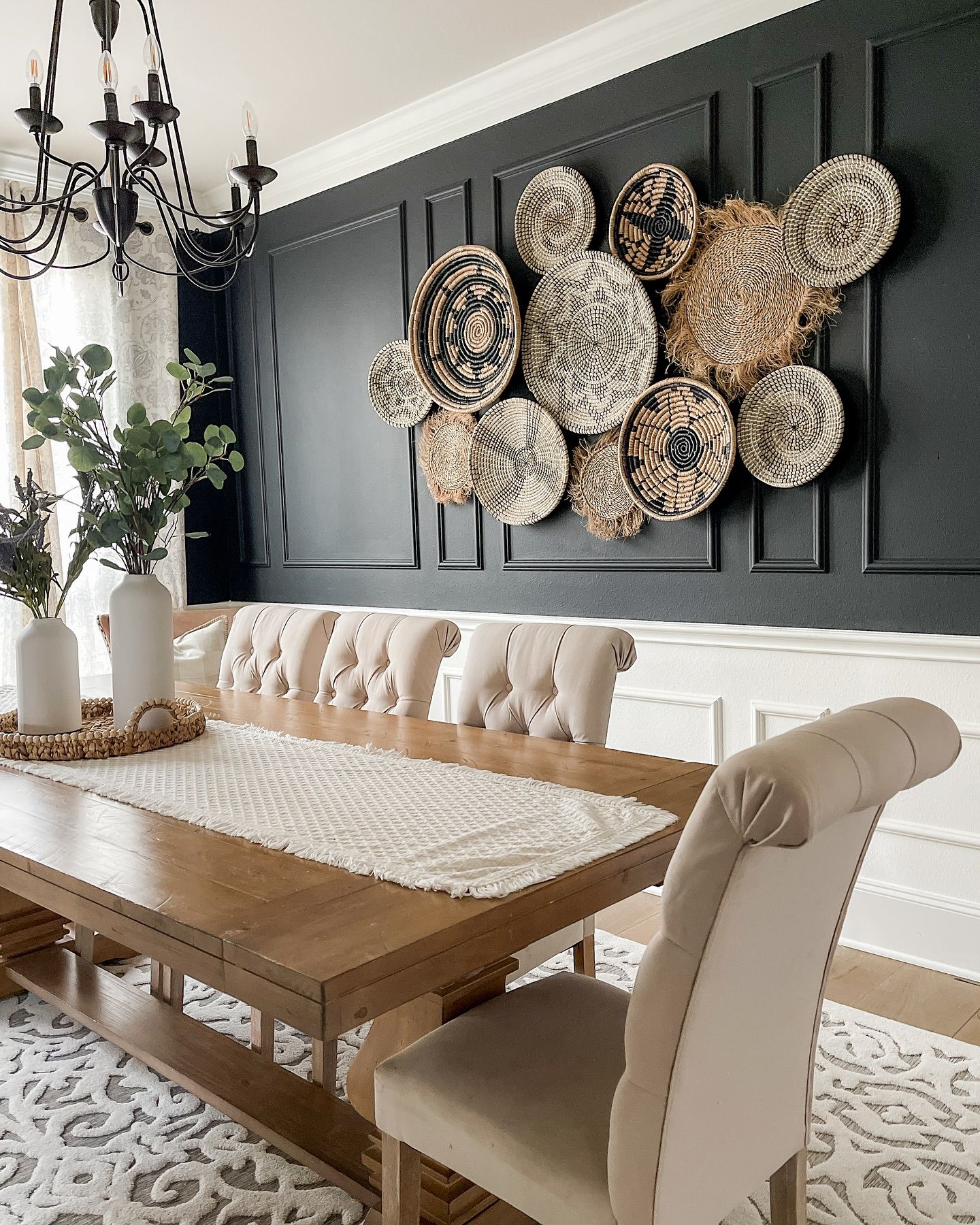 Elegant Dining Room with Black Accent Wall and Boho Decor