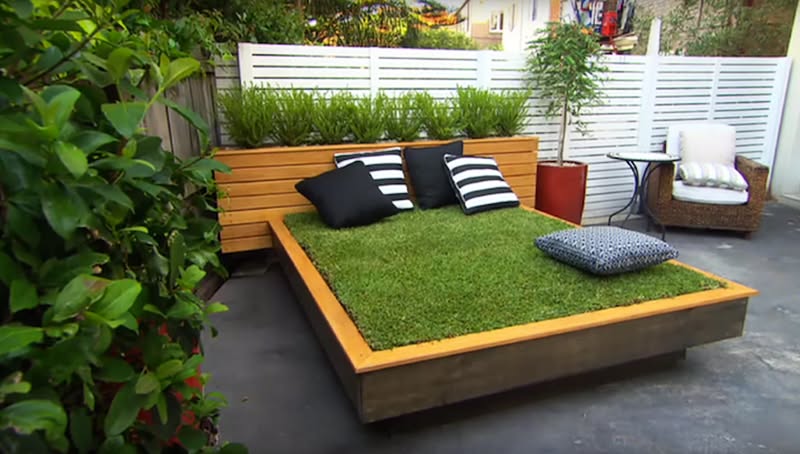 Modern Backyard Lounge with Grass Daybed and Wood Accents