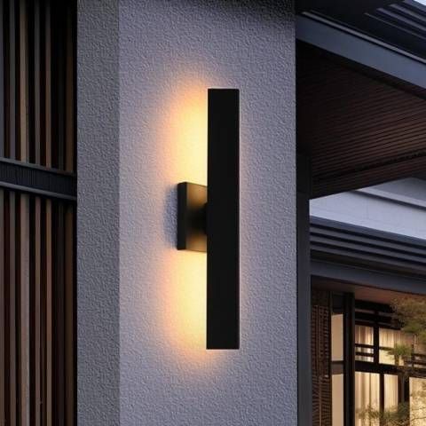 Modern Vertical Outdoor Wall Sconce on Textured Facade