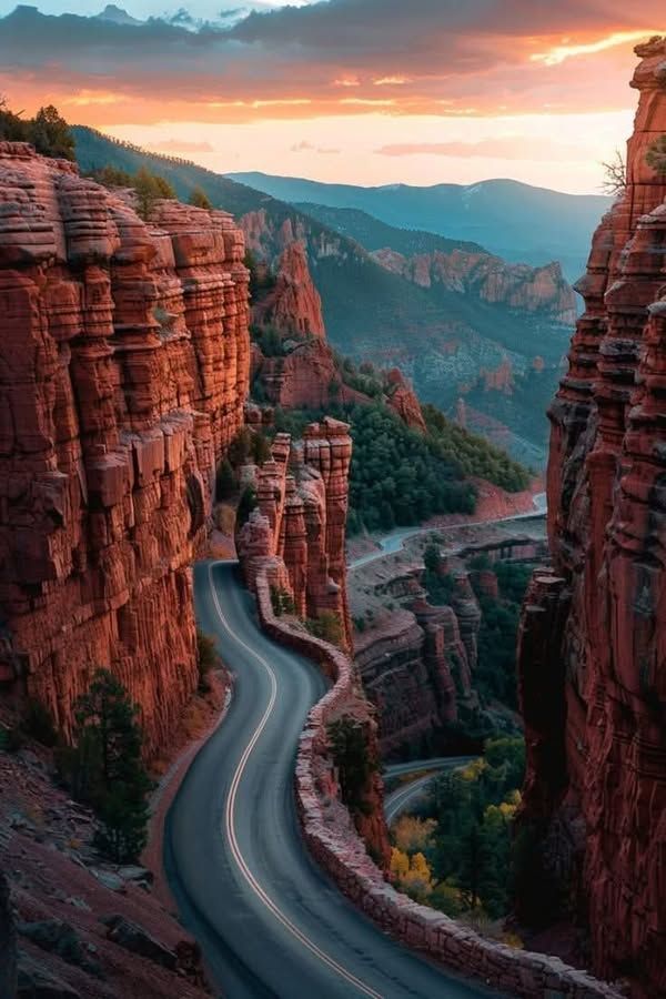 Winding Mountain Road at Sunset with Red Rock Cliffs