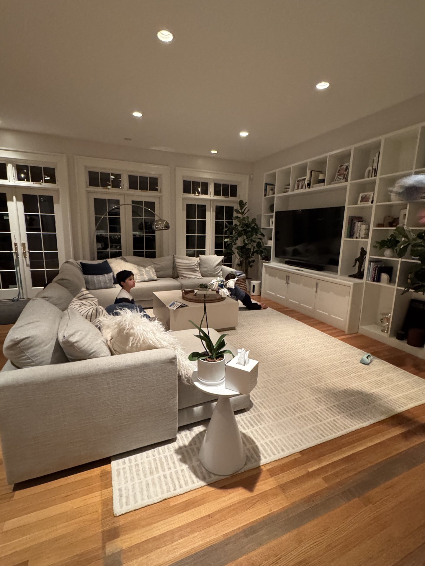 Spacious Modern Living Room With Built-In Shelves and Sectional Sofa